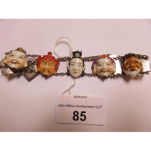 85 - Silver Bracelet with Carved Oriental Faces