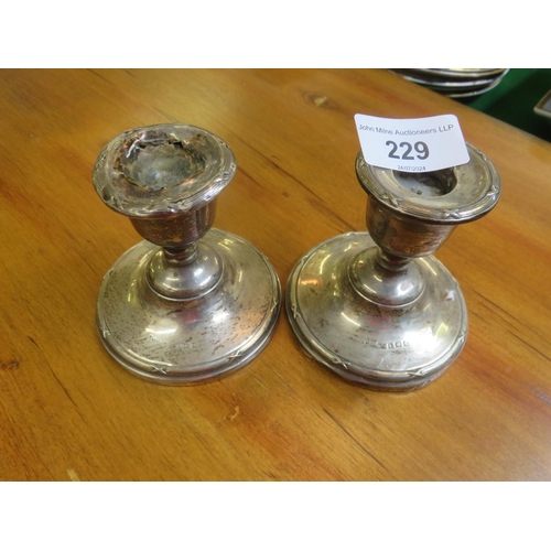 229 - Pair of Silver Dwarf Candlesticks