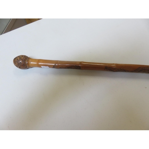 295 - Carved Oriental Poachers Fishing Rod