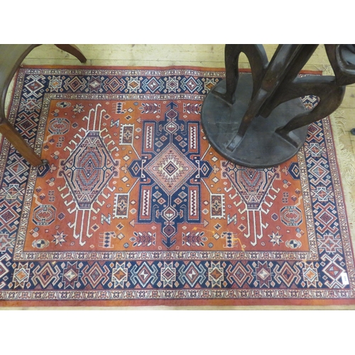 444 - Fringed Rug on Red ground, three central medallions, 55