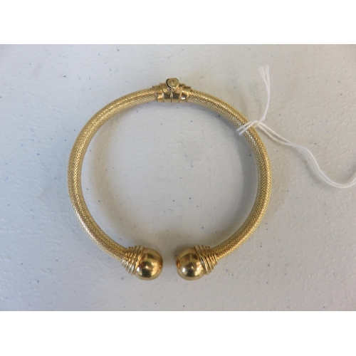 116 - 14ct Gold Spring Opening Bangle 19gms