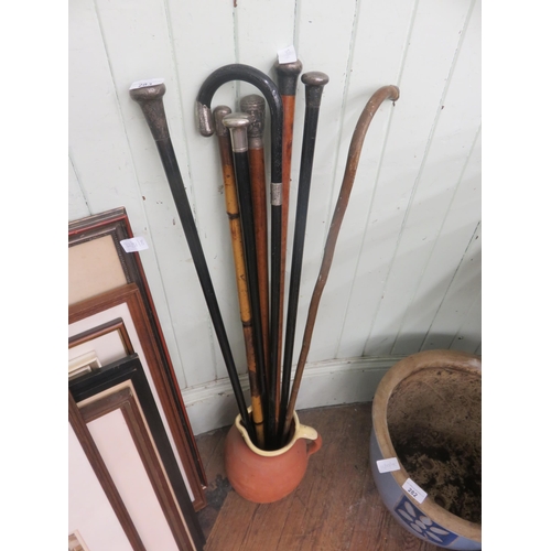 283 - Jug containing Eight Silver Tipped Walking Sticks