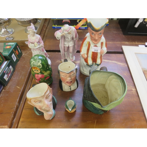 312 - Five Character Jugs, Nesting Doll and Two Other Figures