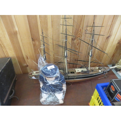 379 - Model Sail Boat And Sailor Doll