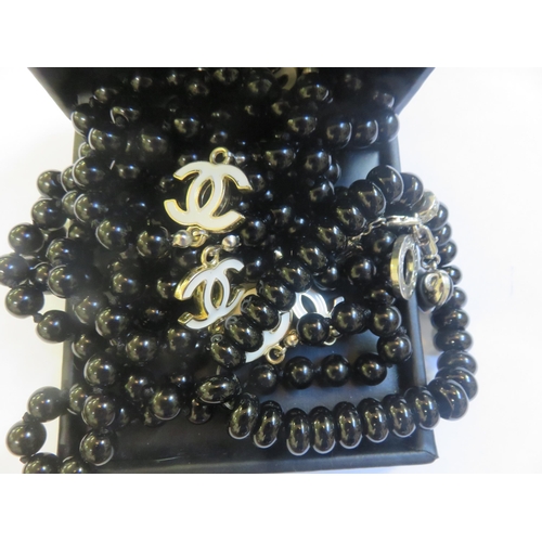 246 - Onyx Beads and Coco Chanel Necklace