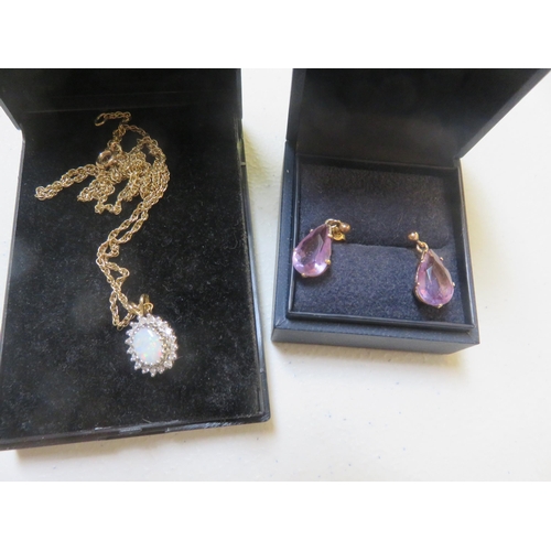 56 - Pair of 9ct. Gold and Amethyst Drop Earrings