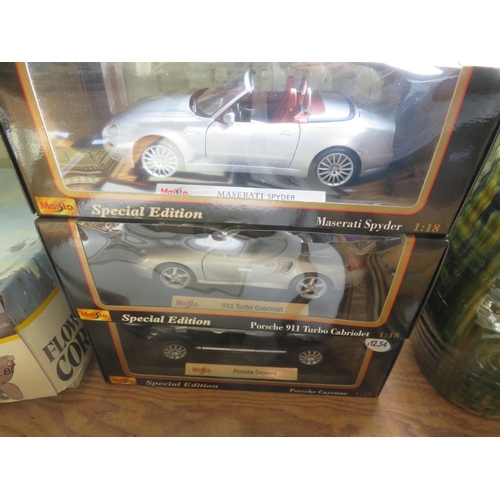 306 - Three Boxed Special Edition Maisto Cars, Maserati Spyder, 911 Porsche Turbo Cabriolet and Porsche Ca... 