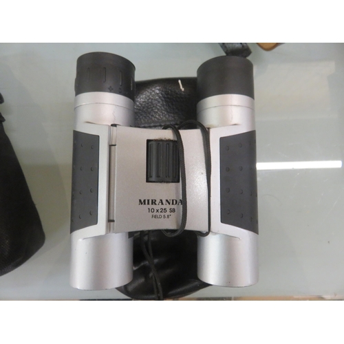 357 - Two pairs of Modern Binoculars and a pair of Opera Glasses