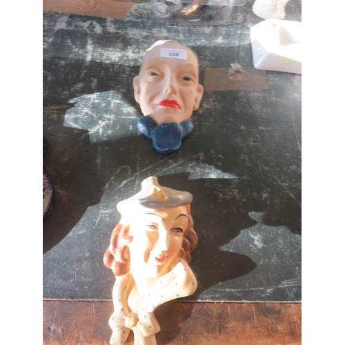 206 - Pair of Male and Female Ceramic Masks