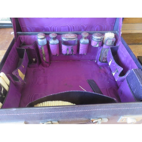 258 - Gentleman's Vanity Case With Eight Silver Mounted Appointments Including Hip Flask