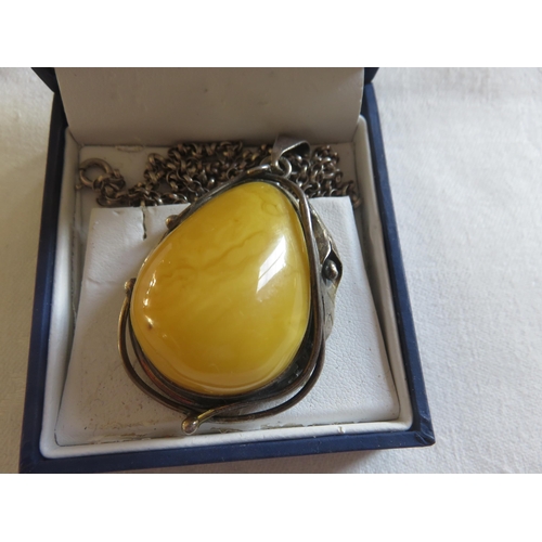 94 - Large Silver egg-yolk Amber Pendant and Chain