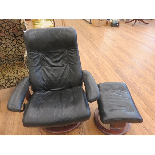 423 - Modern Leather Reclining Armchair and matching Footstool