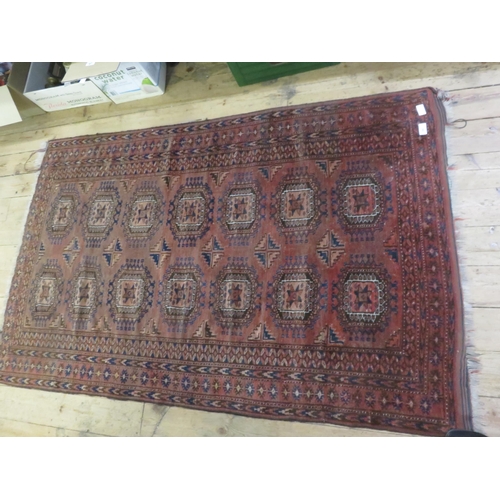 397 - Fringed Persian/Middle Eastern Rug on Red Ground, Multi-Medallion Design