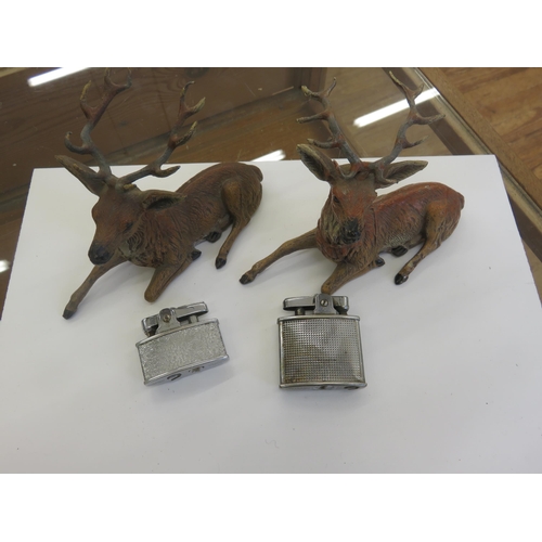 286 - Pair of cold-painted recumbent stag figurines