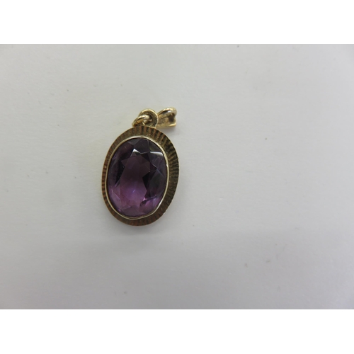 97 - 9ct. Gold Mounted Amethyst Pendant