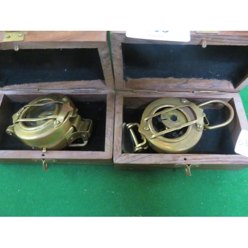 265 - Two boxed Compasses