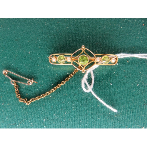 69 - Yellow Metal Bar Brooch with peridot and seed pearls