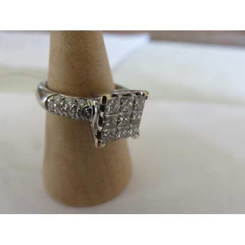 18ct. White Gold and Diamond Ring, centre comprising of nine square cut diamonds, Size J
