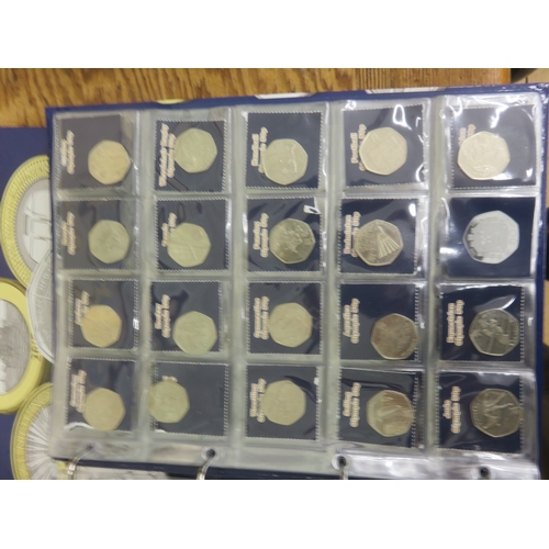 Two Change Checker Albums containing 50 pence, £1 and 10 pence coins