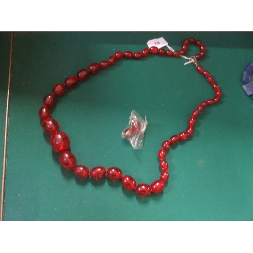 82 - String of Cherry Amber Type Beads and a Pair of Matching Earrings
