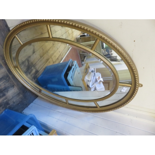 10 - Large Oval Gilt Mirror 112 by 80cm