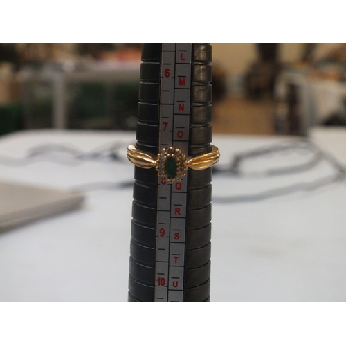 50 - 9ct Central Emerald Ring with Diamond Surround