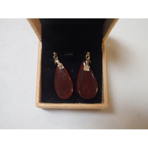 55 - Pair of Deco Yellow Metal Carnelian Pendant Earrings