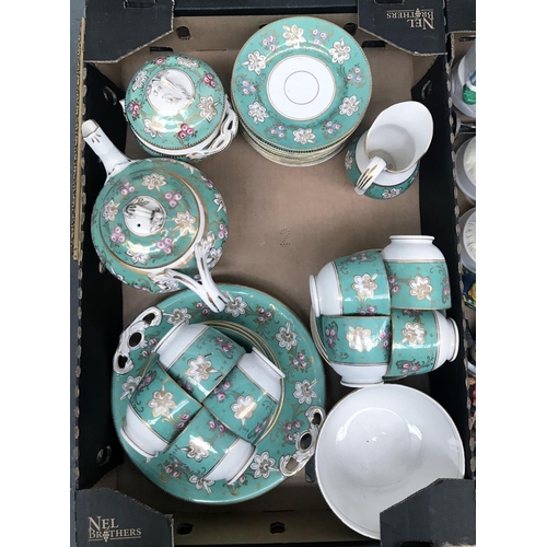 71 - Box containing an ornate tea service