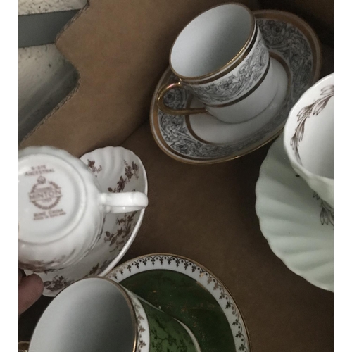 17 - Box containing ornate cups and saucers including Wedgewood etc