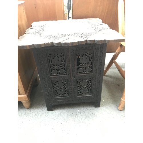 337 - Heavily carved cupboard table