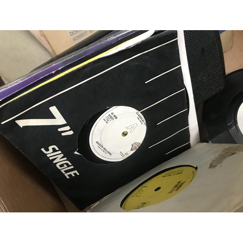 83 - Box containing records and a mini record player