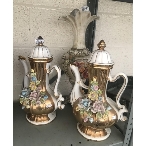 22 - Pair of ornate floral jugs plus one other