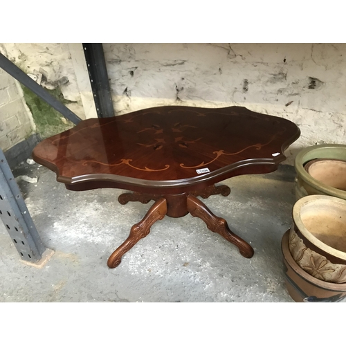 396 - Ornate glass coffee table