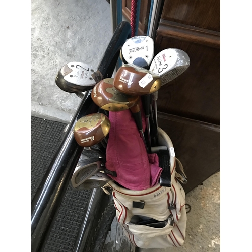 427 - Golf bag and clubs