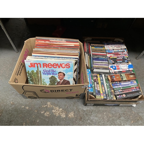 76 - 2 Boxes containing LPs and DVDs