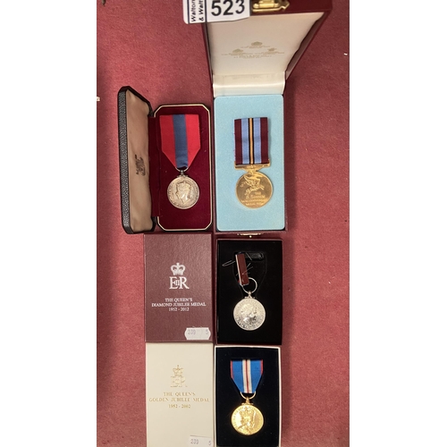 523 - A service medal and 2 Jubilee medals etc