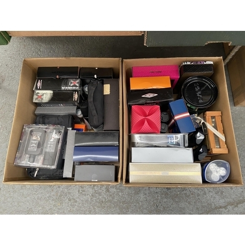 96 - 2 Boxes containing men's toiletries
