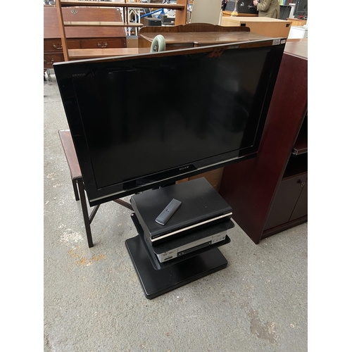 Sony TV on stand and a DVD player