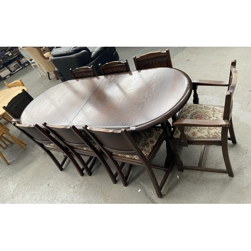 Dark wood dining table and 8 chairs