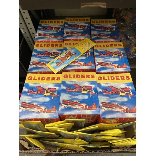 51 - Box containing a large quantity of new glider toys