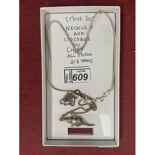 609 - Silver crocodile pendant with chain plus one other