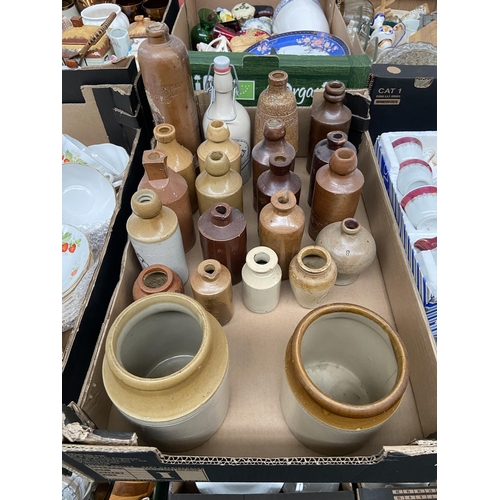 77 - Box containing stoneware bottles