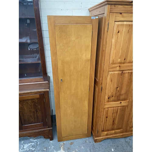 397 - Tall wooden cupboard