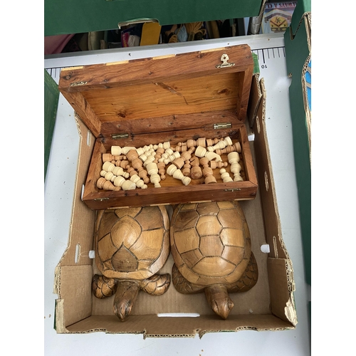 516 - Box containing chess pieces and wooden turtles