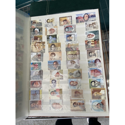 568 - 3 Stock books of world stamps and first day covers