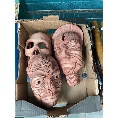 603 - Box containing 3 Terracotta masks