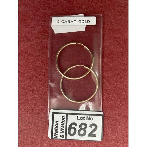 682 - Pair of large 9ct gold hoop earrings