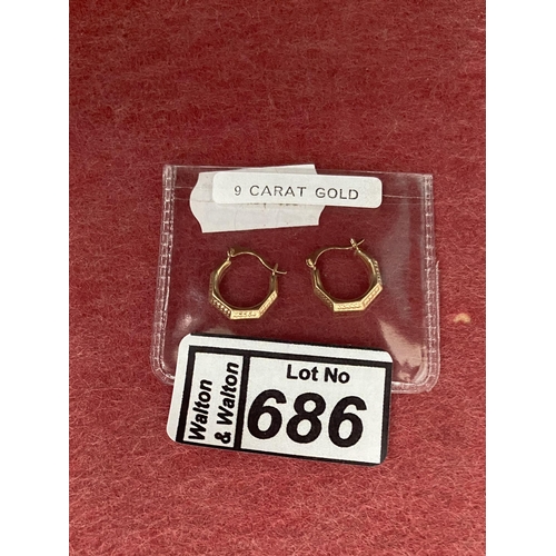 686 - Pair of 9ct gold creole earrings