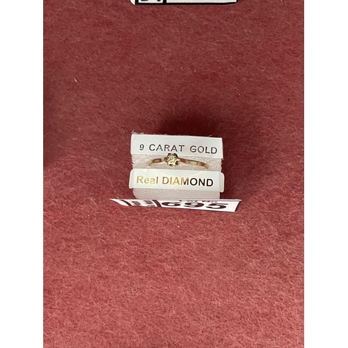 695 - 9ct Gold diamond ring