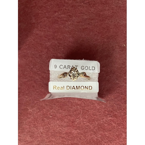 698 - 9ct Gold diamond ring